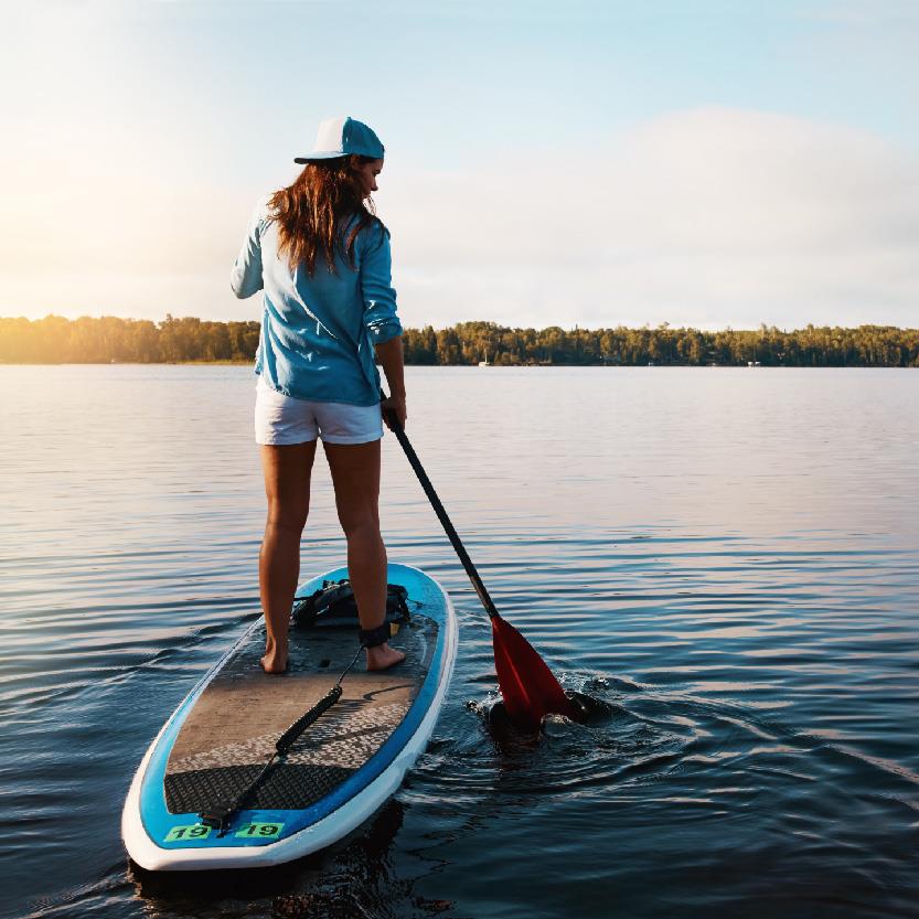 Person Stand Up Paddleboarding