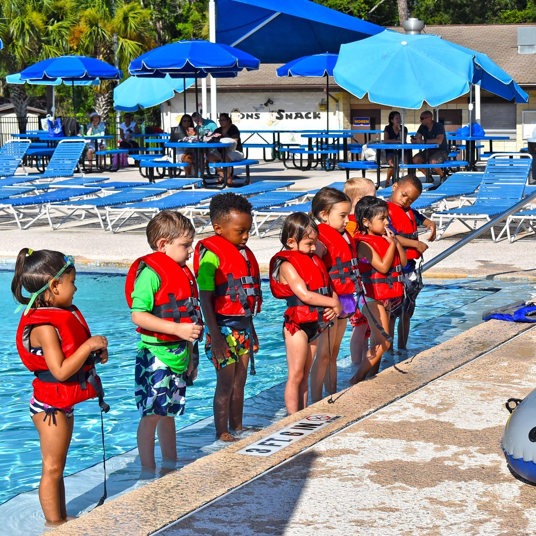 Children Standing at Pool Edge